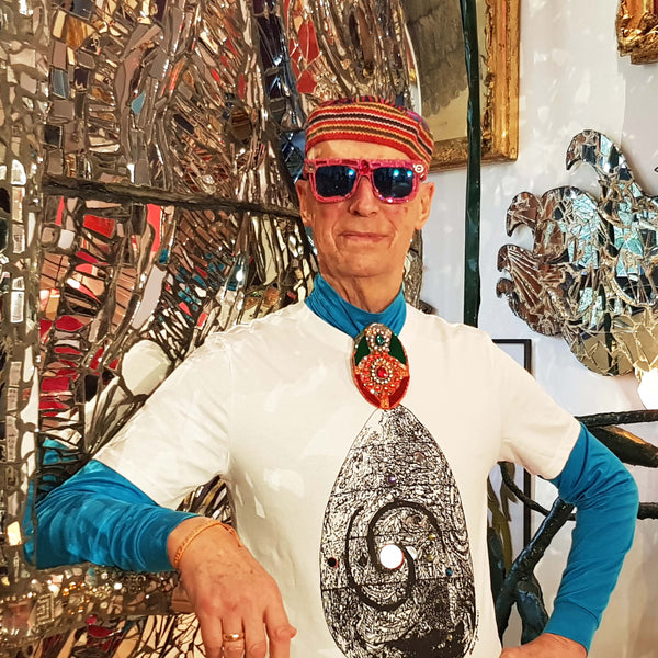 Andrew Logan modelling his customised T-shirt